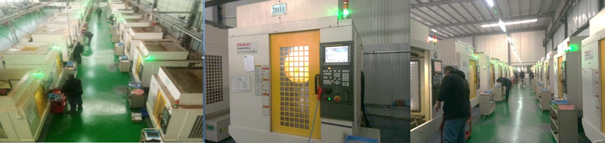 Machining center line showing multiple CNC machines arranged for multi-face milling operations Machining center line showing multiple CNC machines arranged for multi-face milling operations